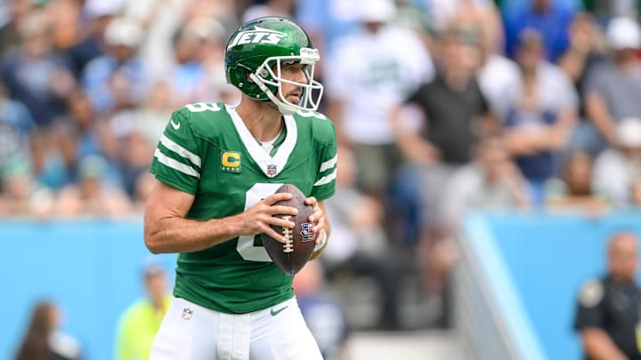 Sep 15, 2024; Nashville, Tennessee, USA;  New York Jets quarterback Aaron Rodgers (8) stands in the pocket against the Tennessee Titans during the first half at Nissan Stadium. Mandatory Credit: Steve Roberts-Imagn Images