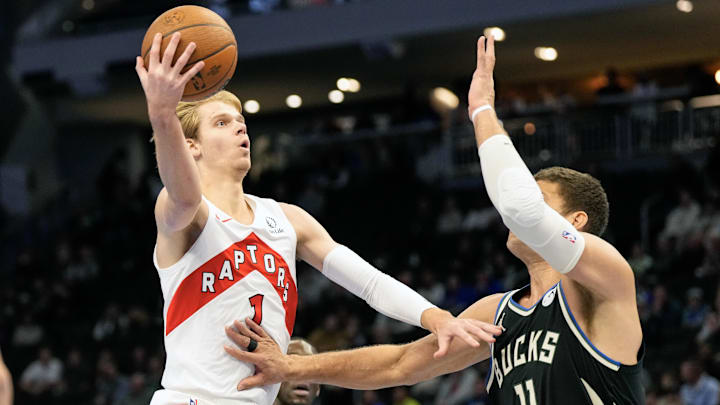 Nov 12, 2024; Milwaukee, Wisconsin, USA; Toronto Raptors guard Gradey Dick (1) shoots against Milwaukee Bucks center Brook Lopez (11) during the first quarter at Fiserv Forum. Mandatory Credit: Jeff Hanisch-Imagn Images Nov 12, 2024; Milwaukee, Wisconsin, USA; Toronto Raptors guard Gradey Dick (1) shoots against Milwaukee Bucks center Brook Lopez (11) during the first quarter at Fiserv Forum. Mandatory Credit: Jeff Hanisch-Imagn Images