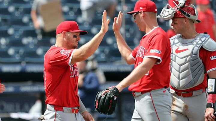 Apr 10, 2025; Tampa, Fl, USA; Los Angeles Angels designated hitter Mike Trout (27) and pitcher Ryan Johnson (32)  high five after they beat the Tampa Bay Rays at George M. Steinbrenner Field. Mandatory Credit: Kim Klement Neitzel-Imagn Images