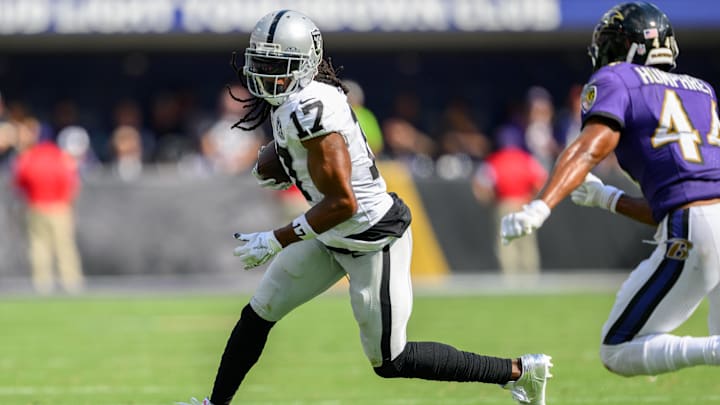 Sep 15, 2024; Baltimore, Maryland, USA; Las Vegas Raiders wide receiver Davante Adams (17) runs with the ball as Baltimore Ravens cornerback Marlon Humphrey (44) defends during the second half at M&T Bank Stadium. Mandatory Credit: Reggie Hildred-Imagn Images Sep 15, 2024; Baltimore, Maryland, USA; Las Vegas Raiders wide receiver Davante Adams (17) runs with the ball as Baltimore Ravens cornerback Marlon Humphrey (44) defends during the second half at M&T Bank Stadium. Mandatory Credit: Reggie Hildred-Imagn Images