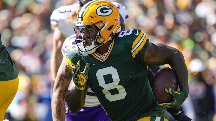 Sep 29, 2024; Green Bay, Wisconsin, USA;  Green Bay Packers running back Josh Jacobs (8) rushes with the football during the first quarter against the Minnesota Vikings at Lambeau Field.