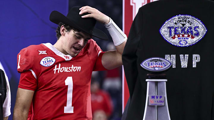 Dec 27, 2025; Houston, TX, USA; Houston Cougars quarterback Conner Weigman (1) puts on the MVP cowboy hat after the win over Louisiana State Tigers at NRG Stadium. Mandatory Credit: Maria Lysaker-Imagn Images 