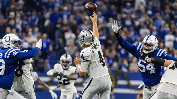 Dec 31, 2023; Indianapolis, Indiana, USA; Las Vegas Raiders quarterback Aidan O'Connell (4) passes a ball between Indianapolis Colts defensive tackle Grover Stewart (90) and defensive end Dayo Odeyingbo (54) in the second half at Lucas Oil Stadium. Mandatory Credit: Trevor Ruszkowski-USA TODAY Sports Dec 31, 2023; Indianapolis, Indiana, USA; Las Vegas Raiders quarterback Aidan O'Connell (4) passes a ball between Indianapolis Colts defensive tackle Grover Stewart (90) and defensive end Dayo Odeyingbo (54) in the second half at Lucas Oil Stadium. Mandatory Credit: Trevor Ruszkowski-USA TODAY Sports
