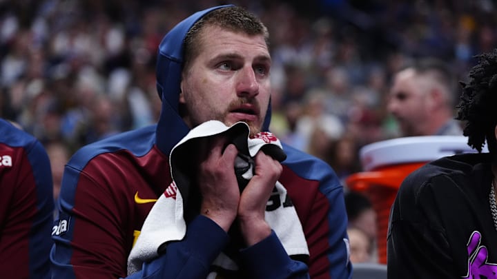 May 3, 2025; Denver, Colorado, USA; Denver Nuggets center Nikola Jokic (15) reacts from the bench in the third quarter against the LA Clippers during game seven of first round for the 2025 NBA Playoffs at Ball Arena. Mandatory Credit: Ron Chenoy-Imagn Images