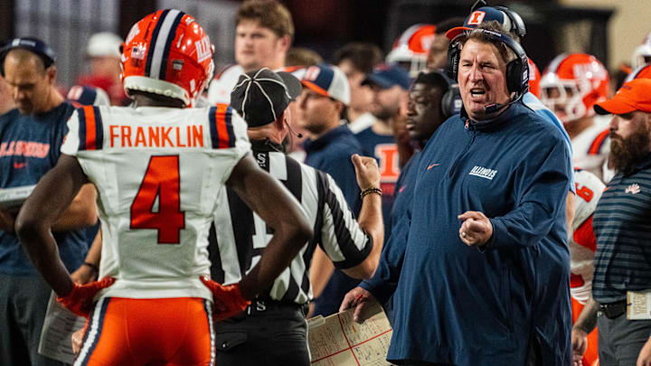 Sep 20, 2024; Lincoln, Nebraska, USA; Illinois Fighting Illini head coach Bret Bielema talks with an official during the second quarter against the Nebraska Cornhuskers at Memorial Stadium. Mandatory Credit: Dylan Widger-Imagn Images
