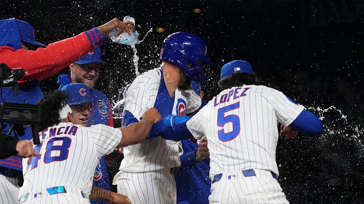 May 5, 2026; Chicago, Illinois, USA; Chicago Cubs first baseman Michael Busch (29) celebrates his walk-off single during the tenth inning against the Cincinnati Reds with with his teammates  at Wrigley Field. Mandatory Credit: David Banks-Imagn Images