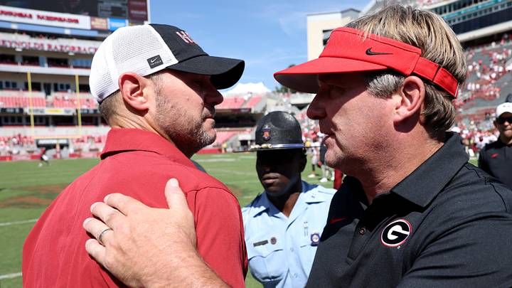 Sep 19, 2026; Fayetteville, Arkansas, USA; Arkansas Razorbacks head coach Ryan Silverfield greets Georgia Bulldogs head coach Kirby Smart at mid field after the game at Donald W. Reynolds Razorback Stadium. Mandatory Credit: Nelson Chenault-Imagn Images Sep 19, 2026; Fayetteville, Arkansas, USA; Arkansas Razorbacks head coach Ryan Silverfield greets Georgia Bulldogs head coach Kirby Smart at mid field after the game at Donald W. Reynolds Razorback Stadium. Mandatory Credit: Nelson Chenault-Imagn Images