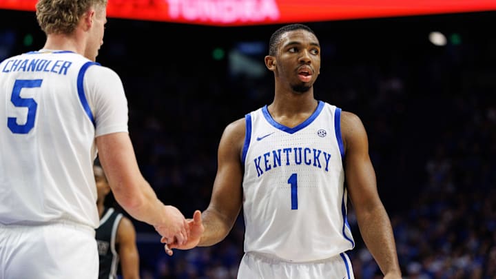 Dec 31, 2024; Lexington, Kentucky, USA; Kentucky Wildcats guard Lamont Butler (1) fives guard Collin Chandler (5) during the first half against the Brown Bears at Rupp Arena at Central Bank Center. Mandatory Credit: Jordan Prather-Imagn Images