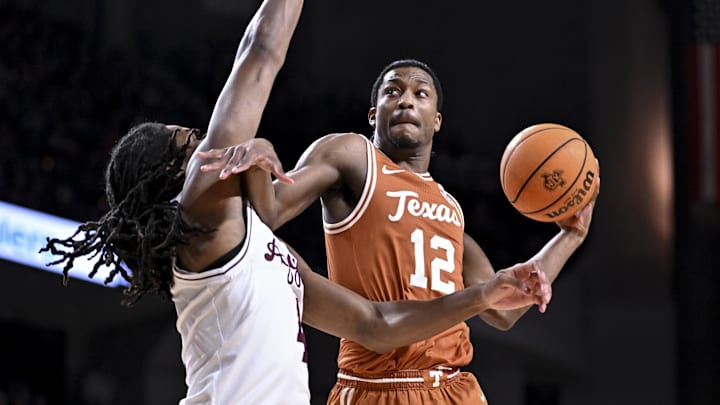 Texas Longhorns guard Tramon Mark  attempts to shoot a basket as Texas A&M Aggies forward Jamie Vinson (4) defends during the first half at Reed Arena. 