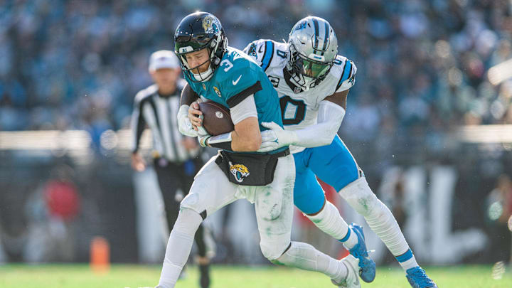 Dec 31, 2023; Jacksonville, Florida, USA; Carolina Panthers linebacker Brian Burns (0) tackles