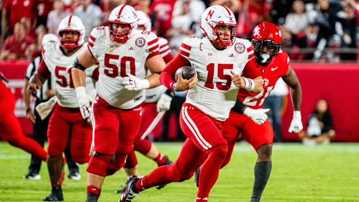 Aug 28, 2025; Kansas City, Missouri, USA; Nebraska Cornhuskers quarterback Dylan Raiola (15) runs against Cincinnati Bearcats wide receiver Taizaun Burns (27) during the third quarter at GEHA Field at Arrowhead Stadium. 