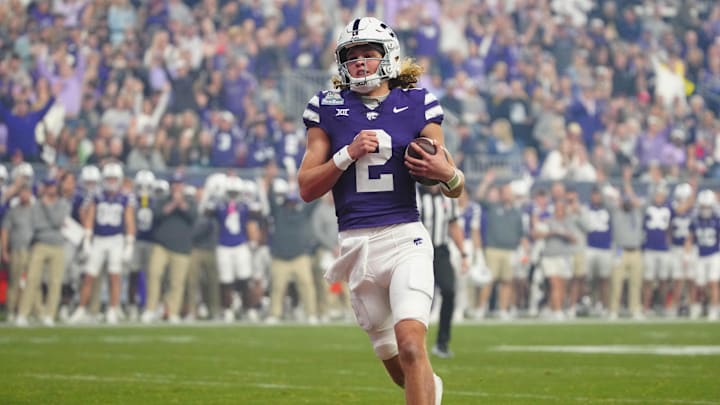 Kansas State quarterback Avery Johnson (2) scores a touchdown against Rutgers during first half of the Rate Bowl at Chase Field on Dec. 26, 2024, in Phoenix. Kansas State quarterback Avery Johnson (2) scores a touchdown against Rutgers during first half of the Rate Bowl at Chase Field on Dec. 26, 2024, in Phoenix.