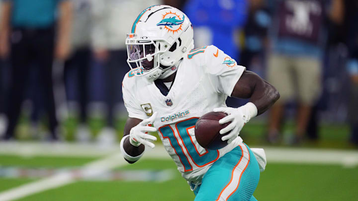 Miami Dolphins wide receiver Tyreek Hill (10) carries the ball against the Los Angeles Rams in the second half at SoFi Stadium. 