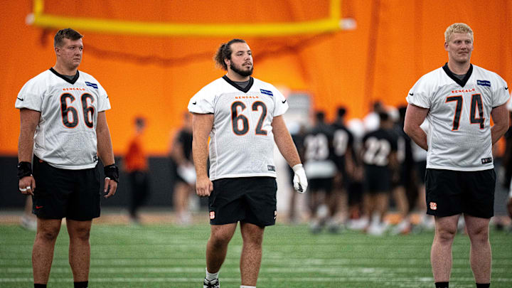 Cincinnati Bengals center Nate Gilliam (66), Cincinnati Bengals center Matt Lee (62) and Cincinnati Bengals offensive tackle Eric Miller (74) look on at Bengals spring practice at the IEL Indoor Facility in Cincinnati on Thursday, June 13, 2024. Cincinnati Bengals center Nate Gilliam (66), Cincinnati Bengals center Matt Lee (62) and Cincinnati Bengals offensive tackle Eric Miller (74) look on at Bengals spring practice at the IEL Indoor Facility in Cincinnati on Thursday, June 13, 2024.