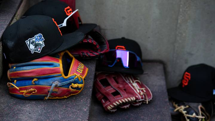 Apr 15, 2026; Cincinnati, Ohio, USA; View of Giants game hats on the dugout steps, with a patch honoring Jackie Robinson during the game between the San Francisco Giants and the Cincinnati Reds at Great American Ball Park. Players and coaches will wear No. 42 in honor of Jackie Robinson Day around the league. Mandatory Credit: Aaron Doster-Imagn Images Apr 15, 2026; Cincinnati, Ohio, USA; View of Giants game hats on the dugout steps, with a patch honoring Jackie Robinson during the game between the San Francisco Giants and the Cincinnati Reds at Great American Ball Park. Players and coaches will wear No. 42 in honor of Jackie Robinson Day around the league. Mandatory Credit: Aaron Doster-Imagn Images