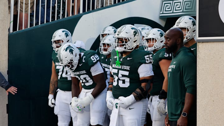 Michigan State football players get ready to run out on the field for their game against Western Michigan (Aug. 29, 2025). 