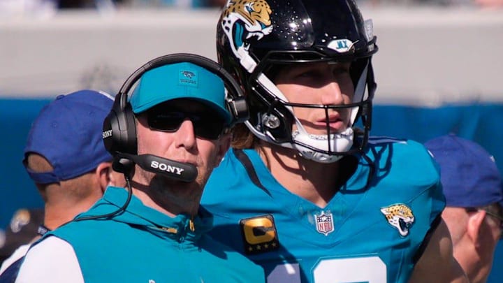 Jacksonville Jaguars head coach Liam Coen talks with Jacksonville Jaguars quarterback Trevor Lawrence (16) during the first quarter during an NFL football game at EverBank Stadium, Sunday, Dec. 14, 2025, in Jacksonville, Fla. [Doug Engle/Florida Times-Union]