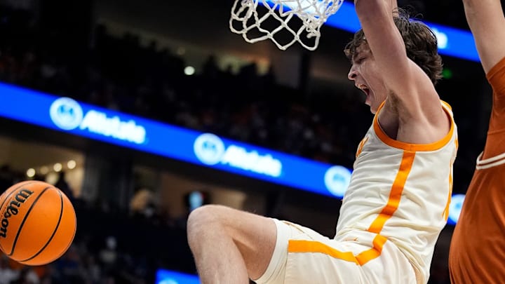 Tennessee forward Cade Phillips (12) dunks against Texas during the second half of a Southeastern Conference tournament quarterfinal game at Bridgestone Arena in Nashville, Tenn., Friday, March 14, 2025. Tennessee forward Cade Phillips (12) dunks against Texas during the second half of a Southeastern Conference tournament quarterfinal game at Bridgestone Arena in Nashville, Tenn., Friday, March 14, 2025.