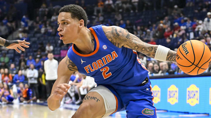 Mar 15, 2024; Nashville, TN, USA; Florida Gators guard Riley Kugel (2) drivbbles against the Alabama Crimson Tide during the first half at Bridgestone Arena. Mandatory Credit: Steve Roberts-Imagn Images