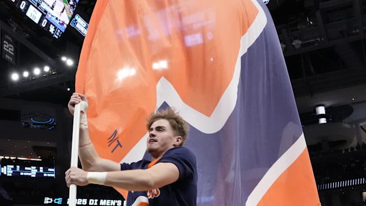 Mar 23, 2025; Milwaukee, WI, USA;  An Illinois Fighting Illini cheerleader performs prior to the game against the Kentucky Wildcats in the second round of the NCAA Tournament at Fiserv Forum. Mandatory Credit: Jeff Hanisch-Imagn Images