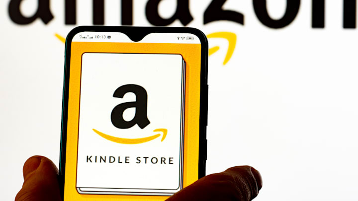 In this photo illustration, Amazon Kindle Store logo seen...
