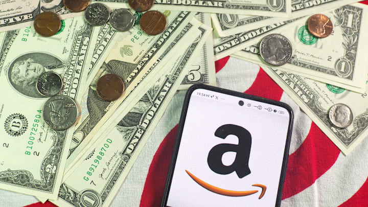 In this photo illustration, an Amazon.com, Inc. logo is seen...