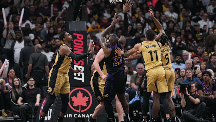 Los Angeles Lakers forward LeBron James (23) drives to the basket over Toronto Raptors forward Bruce Brown (11) during the third quarter at Scotiabank Arena. Mandatory Credit: Nick Turchiaro-Imagn Images Los Angeles Lakers forward LeBron James (23) drives to the basket over Toronto Raptors forward Bruce Brown (11) during the third quarter at Scotiabank Arena. Mandatory Credit: Nick Turchiaro-Imagn Images