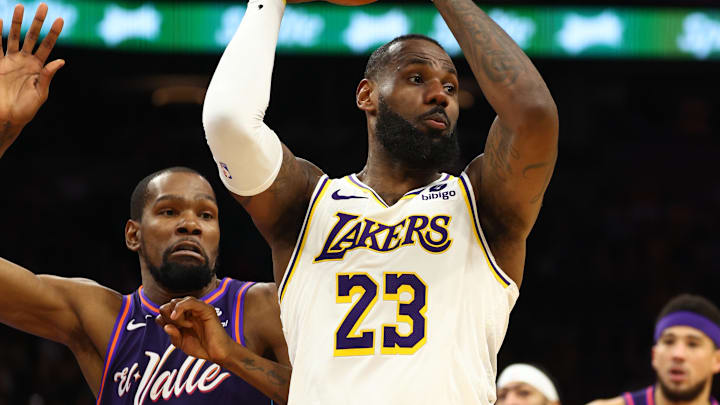Feb 25, 2024; Phoenix, Arizona, USA; Los Angeles Lakers forward LeBron James (23) against Phoenix Suns forward Kevin Durant (35) at Footprint Center. Mandatory Credit: Mark J. Rebilas-Imagn Images