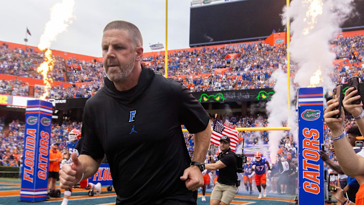 Florida Gators head coach Billy Napier runs onto the field before the start of the game at Ben Hill Griffin Stadium in Gainesville, FL on Saturday, September 7, 2024 against the Samford Bulldogs. The Gators won 45-7. [Doug Engle/Gainesville Sun]