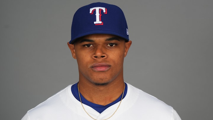 Feb 19, 2025; Surprise, AZ, USA; Texas Rangers pitcher Winston Santos (84) poses for a photo during Media Day at Surprise Stadium. Mandatory Credit: 