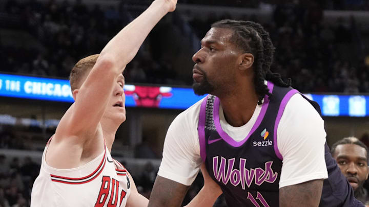 Dec 29, 2025; Chicago, Illinois, USA; Chicago Bulls guard Kevin Huerter (13) defends Minnesota Timberwolves center Naz Reid (11) during the first half at United Center. Mandatory Credit: David Banks-Imagn Images
