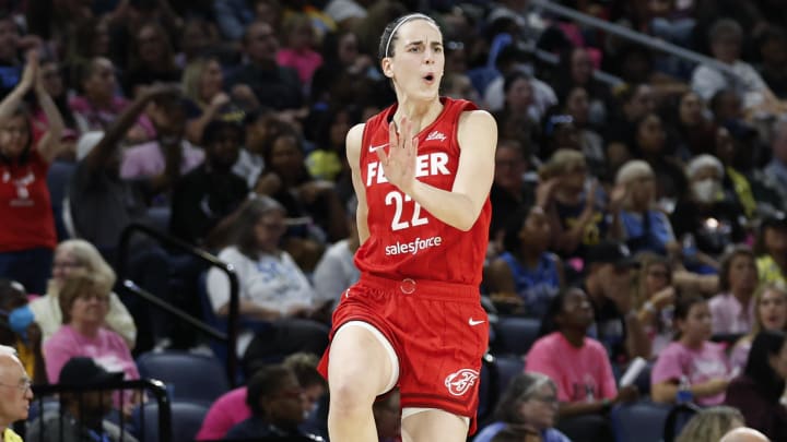 Indiana Fever guard Caitlin Clark (22) celebrates after scoring against the Chicago Sky during the second half at Wintrust Arena. Indiana Fever guard Caitlin Clark (22) celebrates after scoring against the Chicago Sky during the second half at Wintrust Arena.