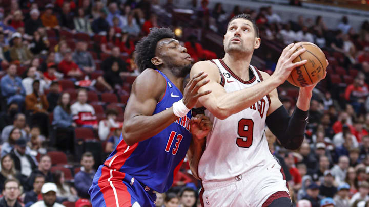 Apr 9, 2023; Chicago, Illinois, USA; Chicago Bulls center Nikola Vucevic (9)drives to the basket against Detroit Pistons center James Wiseman (13) during the first half at United Center. Mandatory Credit: Kamil Krzaczynski-Imagn Images