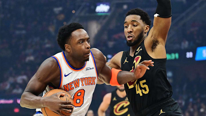 Feb 21, 2025; Cleveland, Ohio, USA;  New York Knicks forward OG Anunoby (8) drives to the basket against Cleveland Cavaliers guard Donovan Mitchell (45) during the first half at Rocket Arena. Mandatory Credit: Ken Blaze-Imagn Images