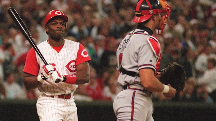 Oct. 11, 1995: Reds' batter Reggie Sanders reacts as he strikes out in the 8th inning with Barry Larkin on third. At right, Javier Lopez readies to throw the ball back to the mound.

Title
