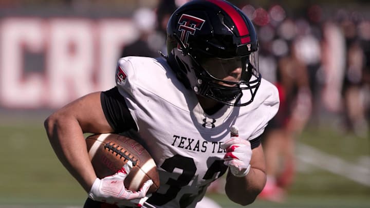 Texas Tech's Cameron Dickey runs with the ball during a spring football practice, Tuesday, March 19, 2024, at the Sports Performance Center.
