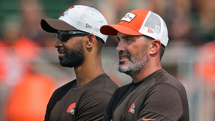 Browns GM Andrew Berry, left, and coach Kevin Stefanski watch practice in training camp, Saturday, July 31, 2021, in Berea.