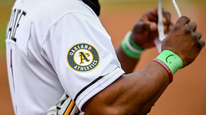 The logo of the Oakland Athletics is seen on the jersey of Lugnuts' Cobie Vance during the first