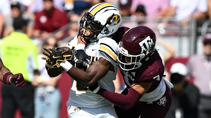 Oct 5, 2024; College Station, Texas, USA; Texas A&M Aggies defensive back Marcus Ratcliffe (3) tackles Missouri Tigers running back Nate Noel (8) in the first quarter at Kyle Field. Mandatory Credit: Maria Lysaker-Imagn Images. 