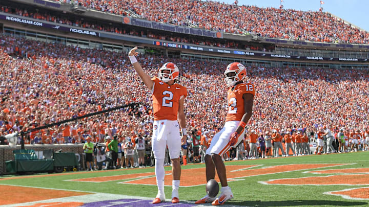 Sep 21, 2024; Clemson, South Carolina, USA; Clemson Tigers quarterback Cade Klubnik (2) waves to the crowd after running in for a touchdown against the North Carolina State Wolfpack at Memorial Stadium. Mandatory Credit: Ken Ruinard-Imagn Images