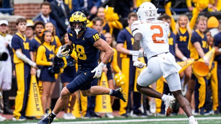 Michigan tight end Colston Loveland (18) makes a catch against Texas defensive back Derek Williams Jr. (2) during the first half at Michigan Stadium in Ann Arbor on Saturday, September 7, 2024. Michigan tight end Colston Loveland (18) makes a catch against Texas defensive back Derek Williams Jr. (2) during the first half at Michigan Stadium in Ann Arbor on Saturday, September 7, 2024.