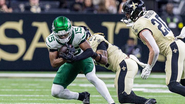 Dec 21, 2025; New Orleans, Louisiana, USA;  New Orleans Saints safety Justin Reid (21) tackles New York Jets wide receiver Adonai Mitchell (15) during the second half  at Caesars Superdome. Mandatory Credit: Stephen Lew-Imagn Images