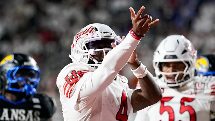 Utah Utes quarterback Devon Dampier (4) celebrates during the second half against the Kansas Jayhawks at Rice-Eccles Stadium. Utah Utes quarterback Devon Dampier (4) celebrates during the second half against the Kansas Jayhawks at Rice-Eccles Stadium.