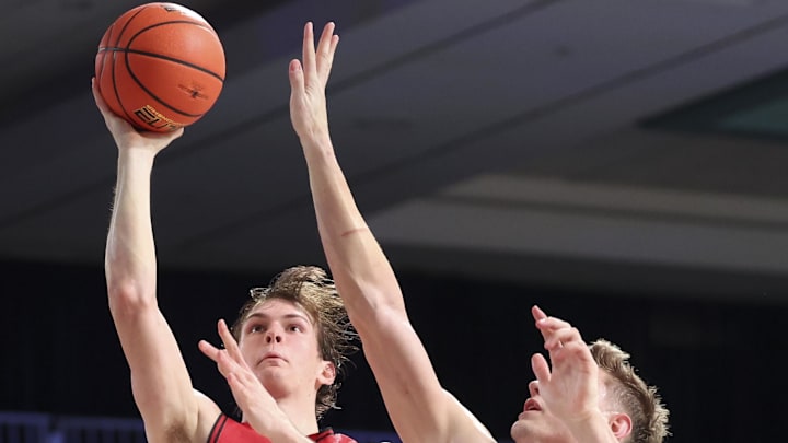 Nov 29, 2024; Paradise Island, Bahamas, BHS;  Davidson Wildcats forward Reed Bailey (1) shoots as Gonzaga Bulldogs forward Ben Gregg (33) deefnds during the second half at Imperial Arena at the Atlantis resort.  Mandatory Credit: Kevin Jairaj-Imagn Images