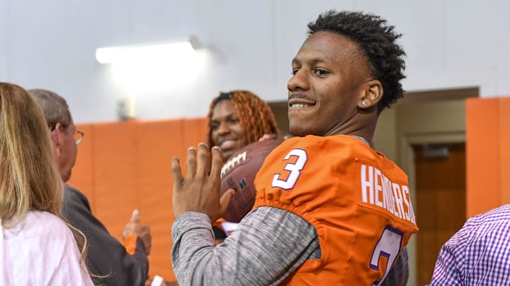 Clemson receiver Marquise Henderson (3) tosses a ball to a child who came with his family to the Clemson Club football National Signing Day wrap up presented by Clemson Seneca Chick-Fil-A at the Poe Indoor Practice Facility at Clemson University in Clemson, S.C. Feb 5, 2025.