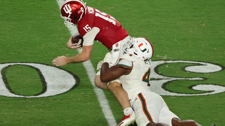 Jan 19, 2026; Miami Gardens, FL, USA; Miami Hurricanes defensive lineman Rueben Bain Jr. (4) sacks Indiana Hoosiers quarterback Fernando Mendoza (15) in the third quarter during the College Football Playoff National Championship game at Hard Rock Stadium. Mandatory Credit: Kim Klement Neitzel-Imagn Images