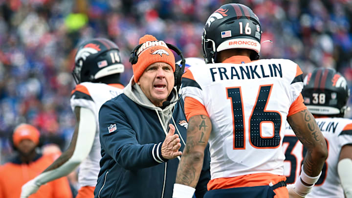Jan 12, 2025; Orchard Park, New York, USA; Denver Broncos head coach Sean Payton has a word with wide receiver Troy Franklin (16) in the fourth quarter of an AFC wild card game against the Buffalo Bills at Highmark Stadium. 