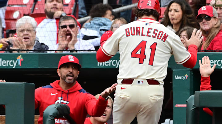 May 4, 2025; St. Louis, Missouri, USA; St. Louis Cardinals first baseman Alec Burleson (41) is congratulated by St. Louis Cardinals manager Oliver Marmol (37) after scoring in the fourth inning against the New York Mets at Busch Stadium. Mandatory Credit: Tim Vizer-Imagn Images