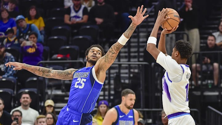 Oct 13, 2025; Salt Lake City, Utah, USA; Dallas Mavericks forward P.J. Washington (25) attempts to block the shot by Utah Jazz forward Ace Bailey (19) during the first quarter at Delta Center. Mandatory Credit: Peter Creveling-Imagn Images