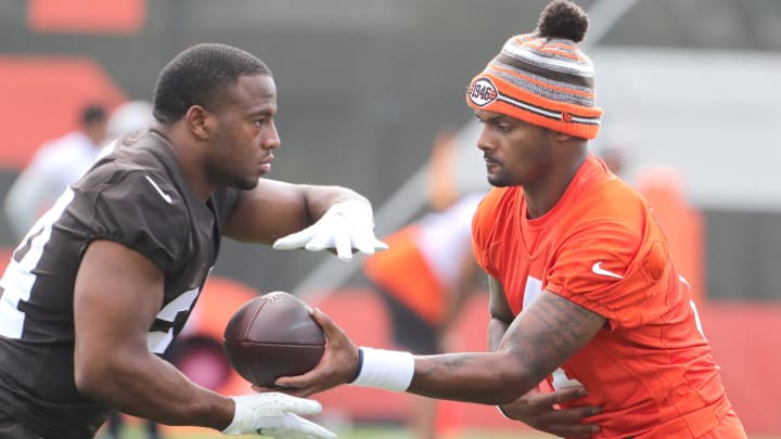 Cleveland Browns quarterback Deshaun Watson hands the ball off to Nick Chubb during OTA workouts on Wednesday, June 1, 2022 in Berea, Oh.